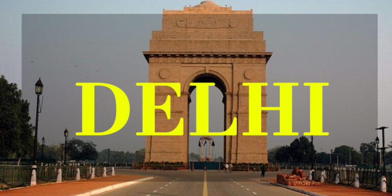 India Gate, one of the iconic places to visit in Delhi, with bold yellow 'DELHI' text overlayed on the image.