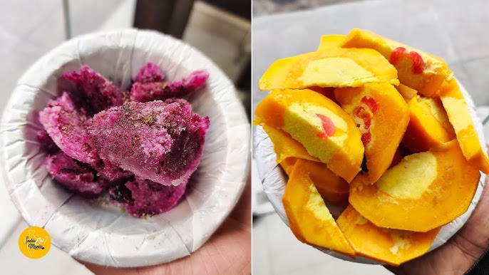 Traditional fruit-stuffed kulfi served at Kuremal Mohan Lal Kulfi Wale in Old Delhi, showcasing the shop’s unique dessert style.